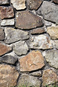 Old weathered rustic stone brick wall texture background