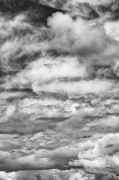 Cloudscape texture background of black and white dramatic monochrome cumulus clouds