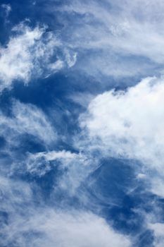Cloudscape texture background of dramatic cirrus and cumulus clouds