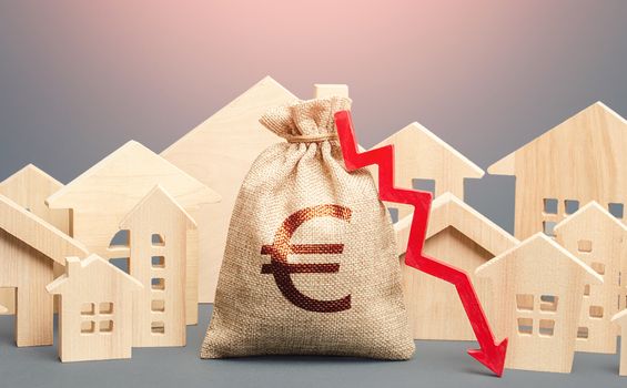 City residential buildings and euro money bag with a red down arrow. Falling prices for rental apartments. Lower mortgage interest rates. Low cost of real estate. Reducing demand for home buying