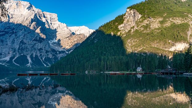 Mountain landscape with reflections on the Braies lake in Val Pusteria, South Tyrol Dolomites