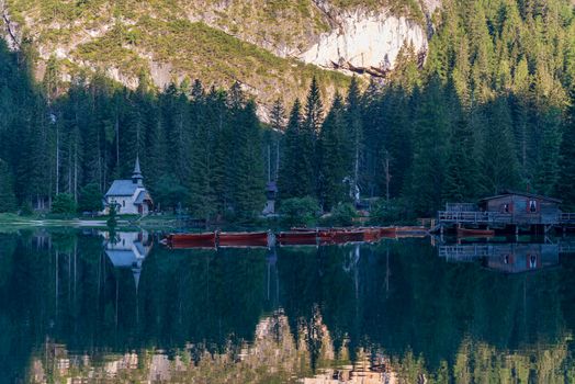 Mountain landscape with reflections on the Braies lake in Val Pusteria, South Tyrol Dolomites