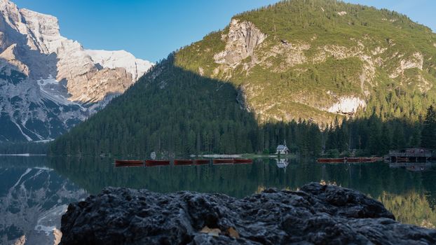 Mountain landscape with reflections on the Braies lake in Val Pusteria, South Tyrol Dolomites