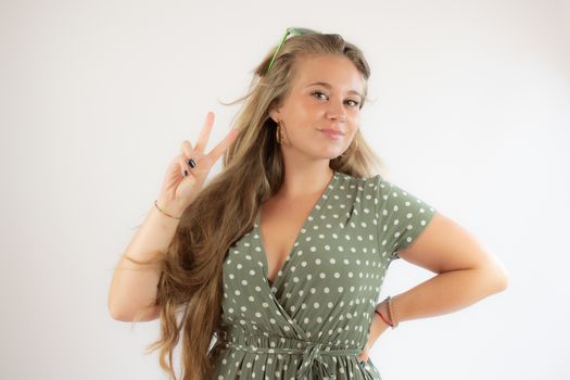 Portrait of a pretty young girl in green dress