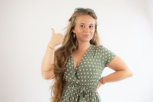 Portrait of a pretty young girl in green dress