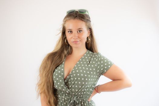 Portrait of a pretty young girl in green dress