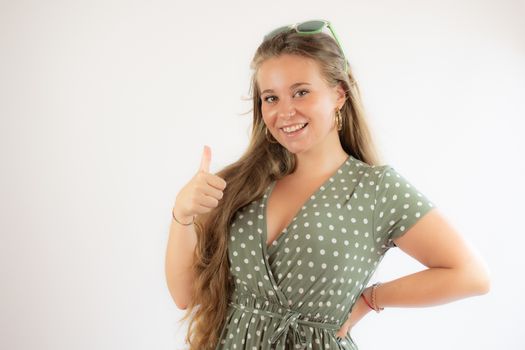 Portrait of a pretty young girl in green dress