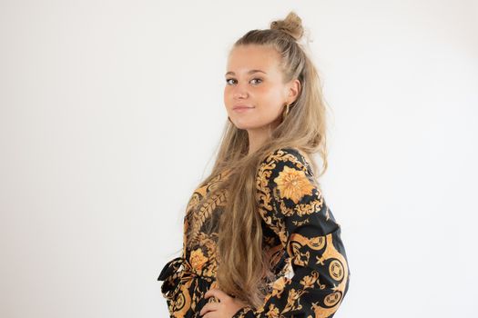 Portrait of a pretty blonde young girl smiling