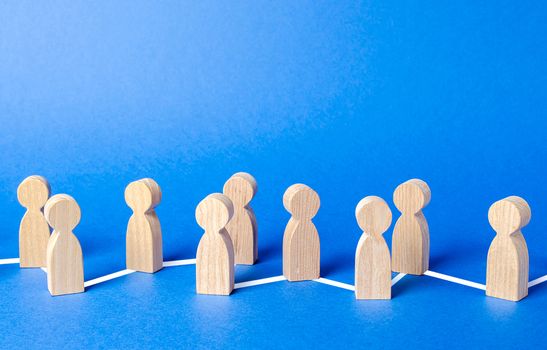 Chain of people figurines connected by lines. Cooperation and interaction between people and employees. Dissemination of information in society, rumors. Communication and social networks.