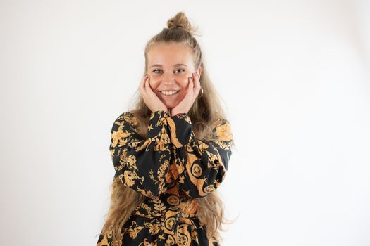 Portrait of a pretty blonde young girl smiling