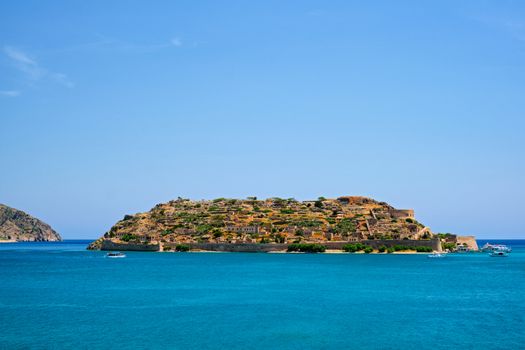 Island of Spinalonga with old fortress former leper colony and the bay of Elounda, Crete island, Greece