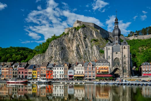 View of picturesque Dinant town, Dinant Citadel and Collegiate Church of Notre Dame de Dinant over the Meuse river. Belgian province of Namur, Blegium