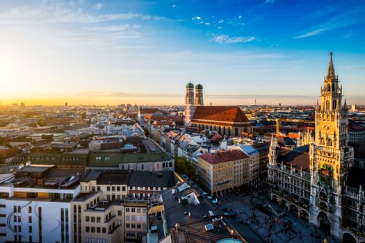 Aerial view of Munich - Marienplatz, Neues Rathaus and Frauenkirche from St. Peter's church on sunset. Munich, Germany