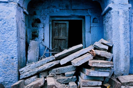 Blue house facade in streets of of Jodhpur, also known as Blue City due to the vivid blue-painted Brahmin houses, Jodhpur, Rajasthan, India