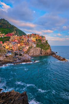 Manarola village popular european italian tourist destination in Cinque Terre National Park UNESCO World Heritage Site, Liguria, Italy on sunset