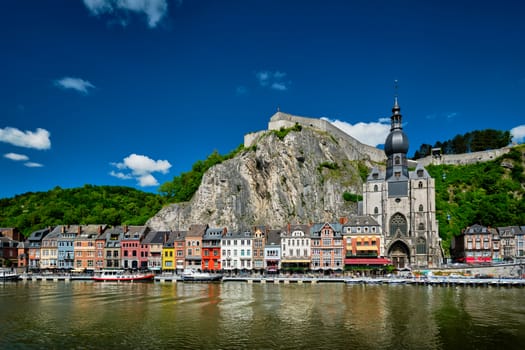 View of picturesque Dinant town, Dinant Citadel and Collegiate Church of Notre Dame de Dinant over the Meuse river. Belgian province of Namur, Blegium