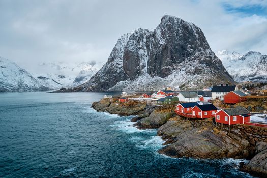 Hamnoy fishing village with red rorbu houses in Norwegian fjord in winter. Lofoten Islands, Norway