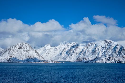 Lofoten islands and Norwegian sea in winter with snow covered mountains. Lofoten islands, Norway