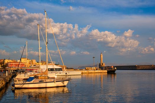Yachts boats in picturesque old port of Chania is one of landmarks and tourist destinations of Crete island in the morning. Chania, Crete, Greece
