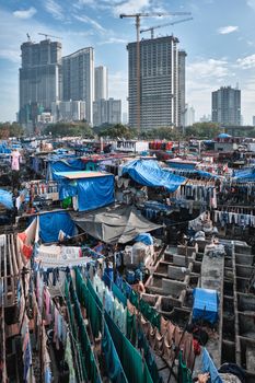 View of Dhobi Ghat (Mahalaxmi Dhobi Ghat) is world largest open air laundromat (lavoir) in Mumbai, India with laundry drying on ropes. Now one of signature landmarks and tourist attractions of Mumbai