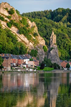 View of picturesque Dinant city over the Meuse river Dinant is a Walloon city and municipality located on the River Meuse, in the Belgian province of Namur on sunset with Bayard Rock and highway