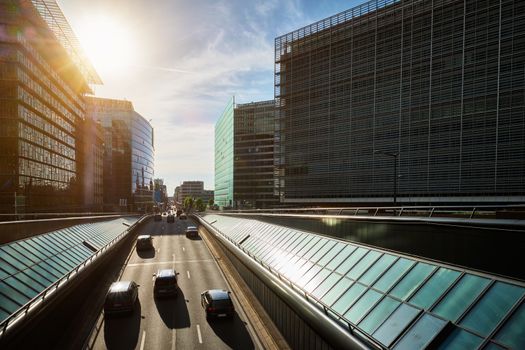 Street traffic in Brussels near European Commission building on sunset. Rue de la Loi , Bruxelles, Belgium