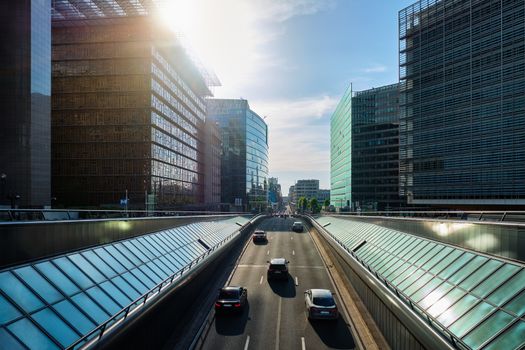 Street traffic in Brussels near European Commission building on sunset. Rue de la Loi , Bruxelles, Belgium