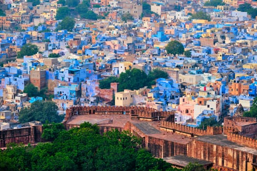 Aerial view of Jodhpur, also known as Blue City due to the vivid blue-painted Brahmin. View from Mehrangarh Fort (part of fortifications is also visible). Jodphur, Rajasthan, India