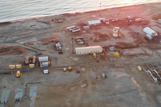 An oil field by the sea. service buildings and equipment.