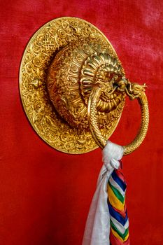 Lion shaped door handle in Buddhist temple. Kaza, Spiti Valley, Himachal Pradesh, India