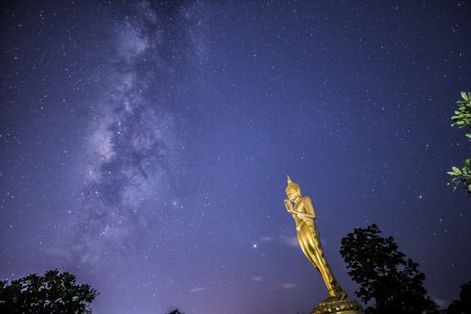 Buddha statue on the milky way background in Thailand