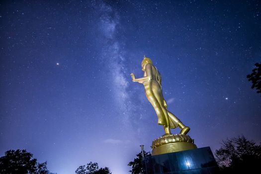 Buddha statue on the milky way background in Thailand