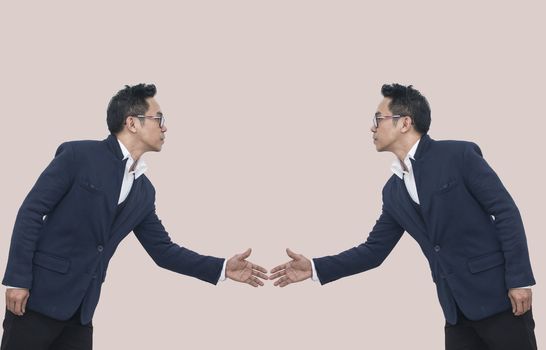 Two Asian Business man extending hand to shake