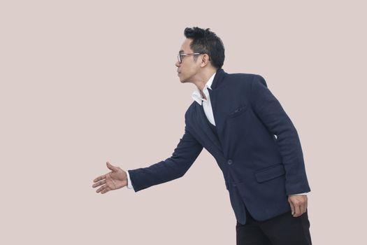 Asian Business man extending hand to shake