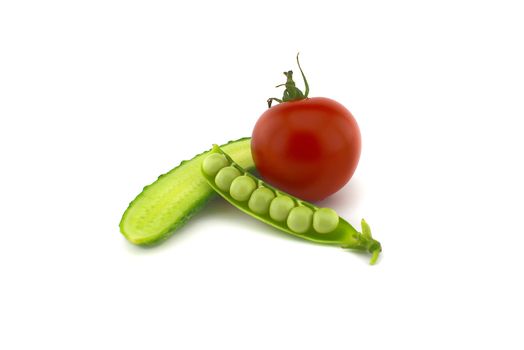 Red ripe tomato, peas in a pod and cucumber isolated on white background
