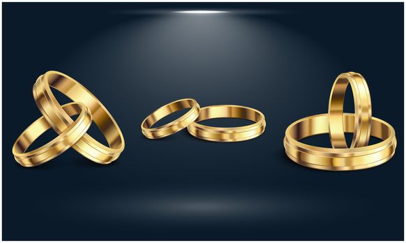 Couple Gold rings on the abstract dark background