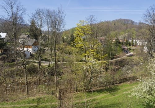 View on Village Hejnice with cottages and creek in spring, Hejnice, Jizera mountain, Czech Republic.
