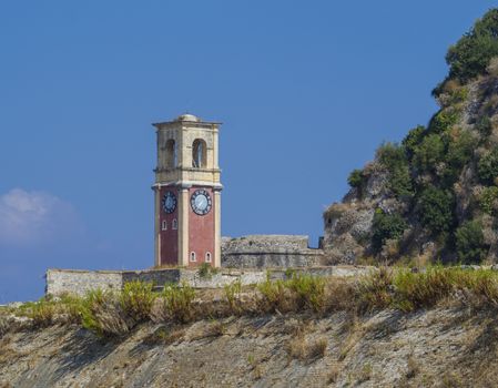 The view of clock tower in old Byzantine fortress in Kerkyra, Corfu island in Greece.