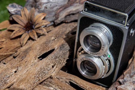 Vintage two lens photo camera on wooden background. An idea of old camera and memory, time Nostalgia.