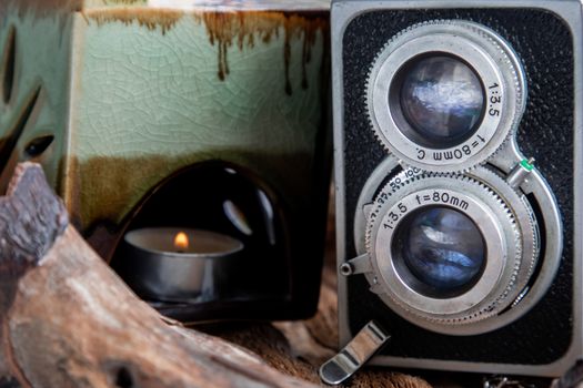 Vintage two lens photo camera on wooden background. An idea of old camera and memory, time Nostalgia.