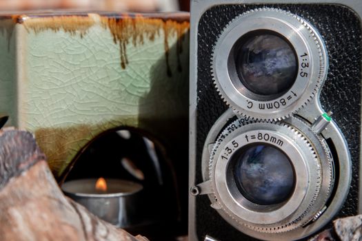 Vintage two lens photo camera on wooden background. An idea of old camera and memory, time Nostalgia.