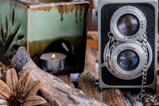 Vintage two lens photo camera on wooden background. An idea of old camera and memory, time Nostalgia.