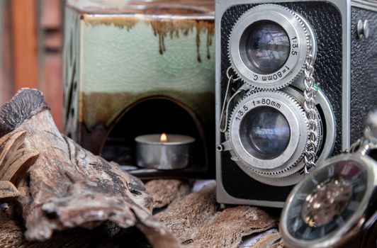 Vintage two lens photo camera on wooden background. An idea of old camera and memory, time Nostalgia.