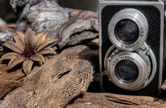 Vintage two lens photo camera on wooden background. An idea of old camera and memory, time Nostalgia.