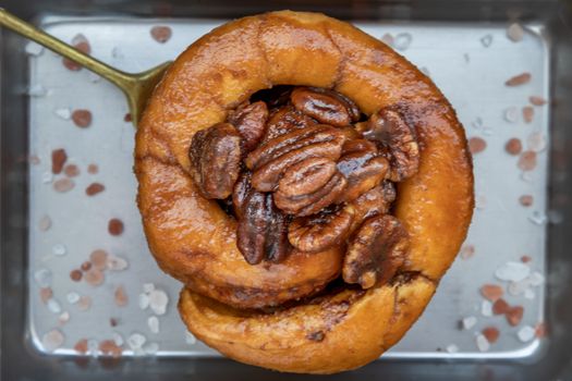 Traditional French sweet dessert : Close-up of Pecan peanut Brioche on the silver tray. Delicious seasonal breakfast, Selective focus.