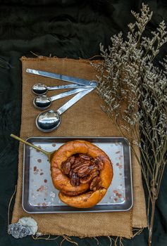 Traditional French sweet dessert : Pecan peanut Brioche on the silver tray. Delicious seasonal breakfast, Top view. Selective focus.