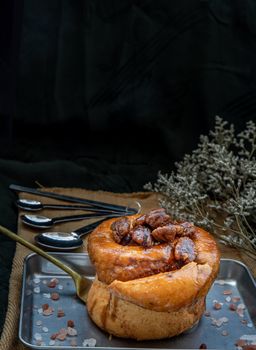 Traditional French sweet dessert : Pecan peanut Brioche on the silver tray. Delicious seasonal breakfast, Oblique view from the top. Selective focus.