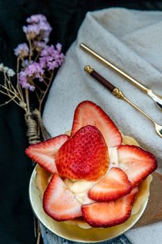 Traditional French sweet dessert : Strawberry tart on beautiful background. One piece, Delicious seasonal breakfast. Top view, Selective focus.