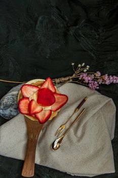 Traditional French sweet dessert : Strawberry tart on beautiful background. One piece, Delicious seasonal breakfast. Top view, Selective focus.