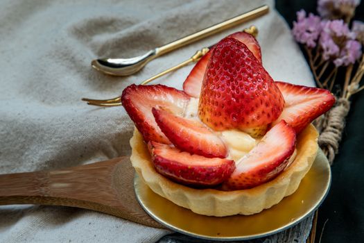 Traditional French sweet dessert : Strawberry tart on beautiful background. One piece, Delicious seasonal breakfast.  Selective focus.